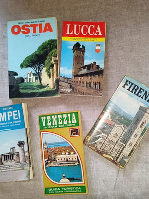 Set of vintage used tourist guides for Italian cities