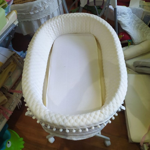 Bassinet on wooden base with wheels like new