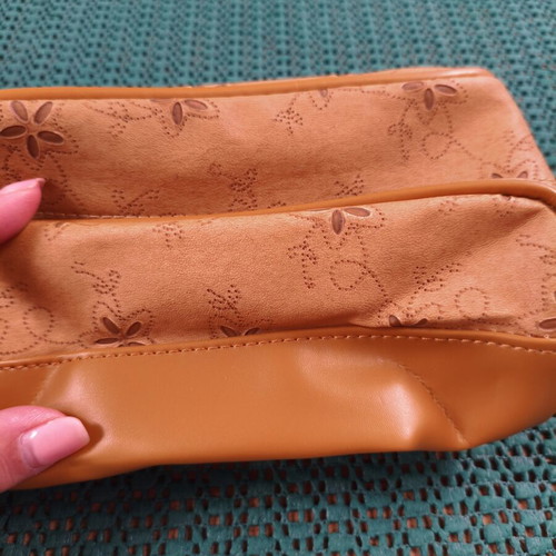 Women's cosmetic bag with floral punch-out design, synthetic leather, camel