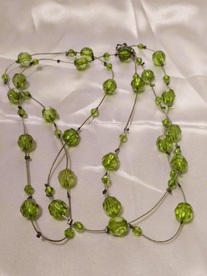 Long necklace used in modern green vintage 2000 style
