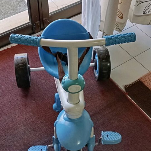Fisher Price children's bike like new with straps and handle