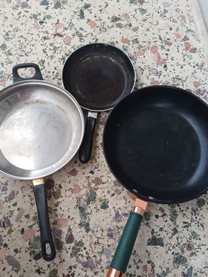 Set of 3 frying pans used, one with lid