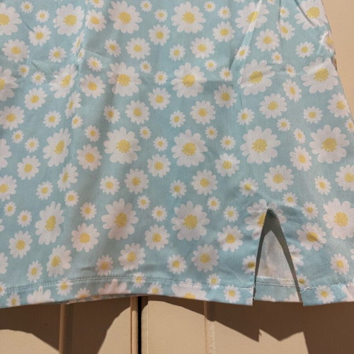 Mini skirt with daisies on blue background, size S, like new