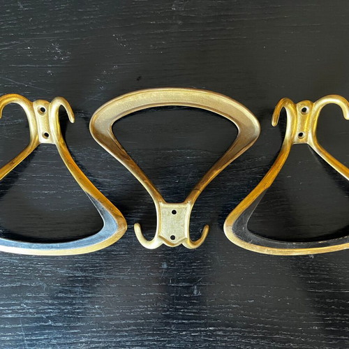 3 gold metal wall hooks