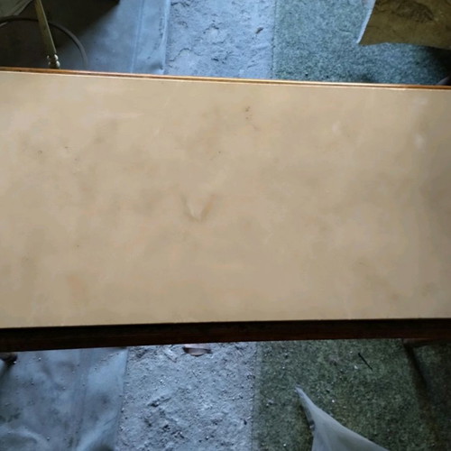 Coffee table with wooden base and marble top used