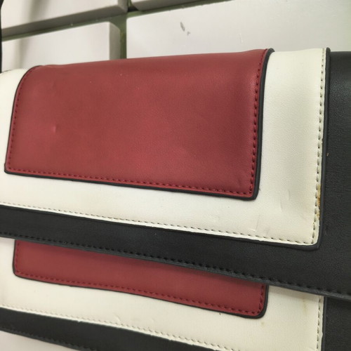 Shoulder bag with adjustable strap, black and red