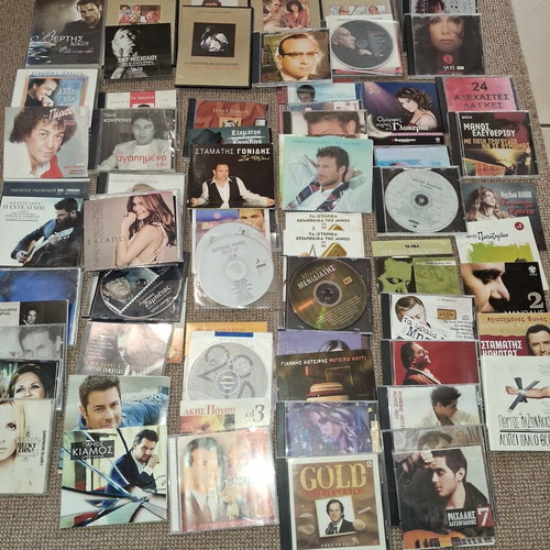 Music CDs used, pack of 100 with various Greek artists