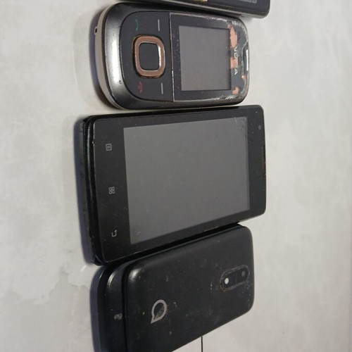 Old mobile phones used for spare parts, all together