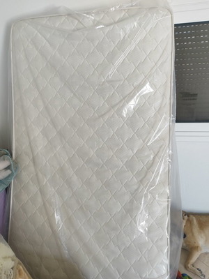 Single mattress used, white color, quilted with handles