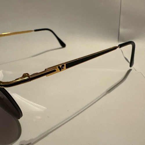 Vintage Vogue sunglasses with gold and black details, new