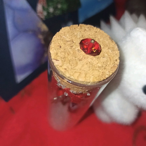 Christmas charm new in glass bottle with evil eye and small gem