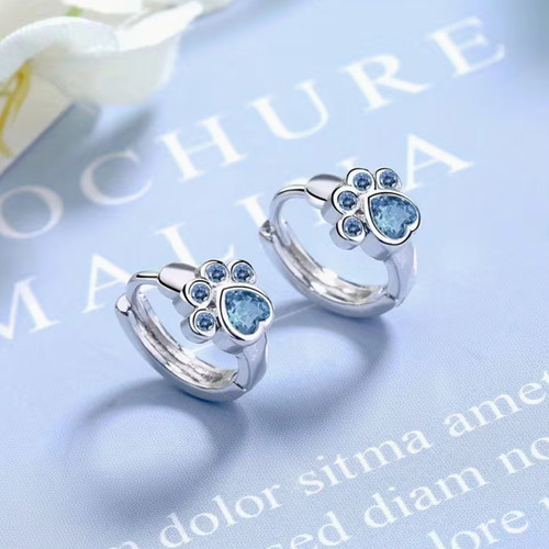 Paw print earrings new with blue stones