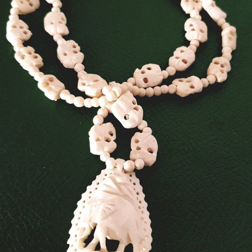Carved vintage bone necklace with elephant pendant