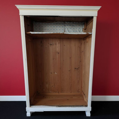 Open wooden wardrobe used, white frame with natural wood interior