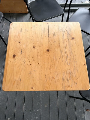 Table used with wood and metal base