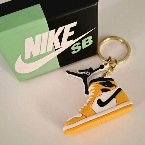 Nike keychain new, yellow and black in box