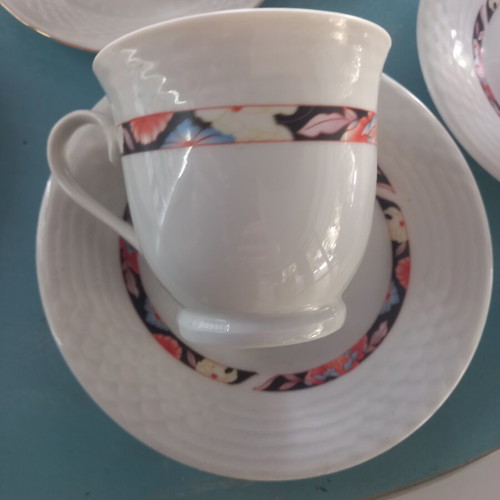 Set of 7 assorted cups and saucers