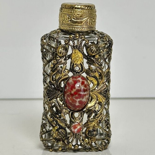 Vintage perfume flacon with filigree metalwork and red cabochon