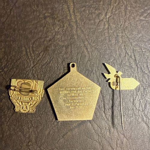 Set of 3 collectible metal badges and pins from East Germany, new