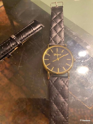 Geneva watch used with black quilted leatherette strap and gold case