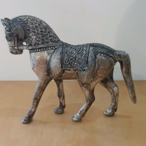 Vintage metal horse used with carved details