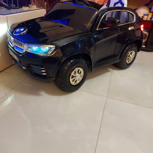 BMW X6 electric ride-on car like new with remote control and LED lights
