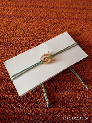 Bracelet new with adjustable strap and gold metal design