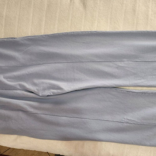 Sky blue jumpsuit in a wide straight line.