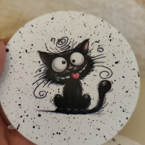 Handmade coasters with black base and 4 playful cat designs