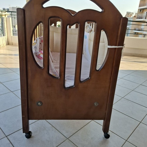 Wooden Baby Crib with Wheels and Protective Bumper, Walnut Color