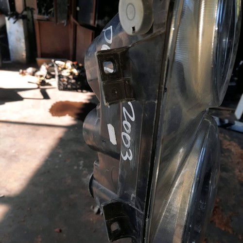 Vw Polo 05mod left front headlight used, broken mount