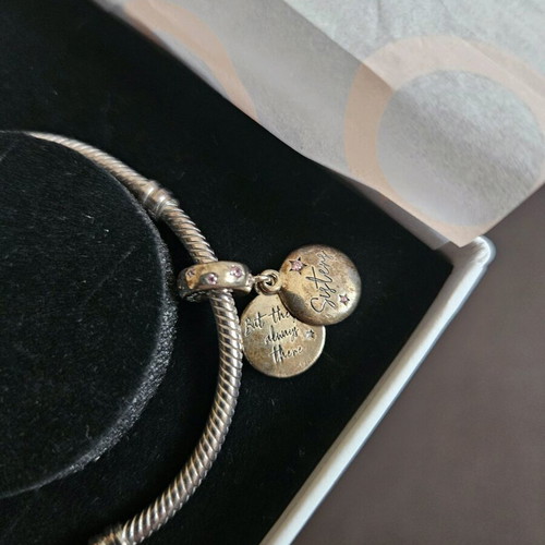 Pandora sterling silver charm bracelet with heart and sister charms like new