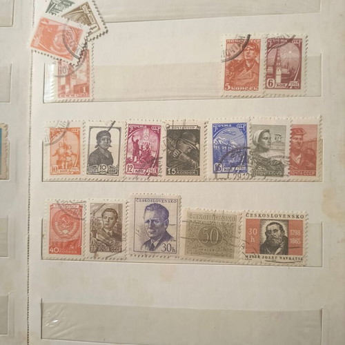 Stamp album like new with about 500 mostly foreign stamps