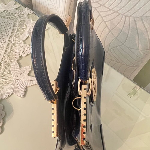 Navy Blue Lustre Handbag like new with gold metal details