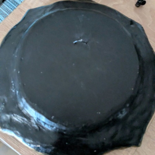Decorative ceramic plate used with embossed design