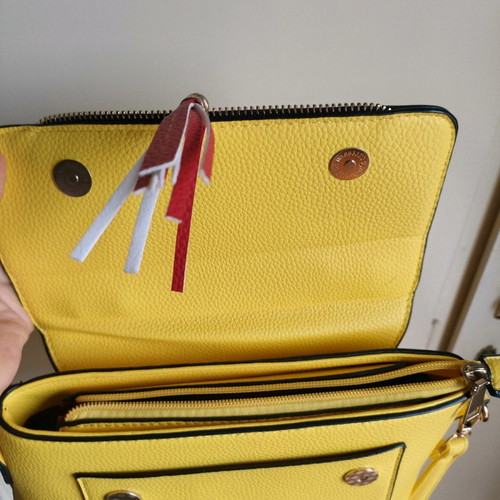 Yellow crossbody bag used with detachable strap