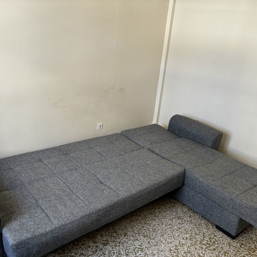 Corner sofa bed with storage compartments