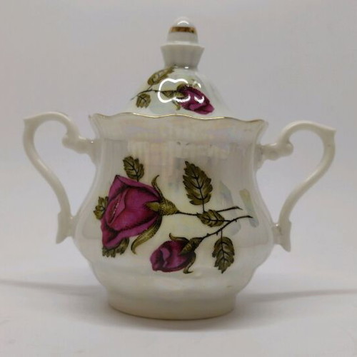 Porcelain sugar bowl with roses and gold trim like new