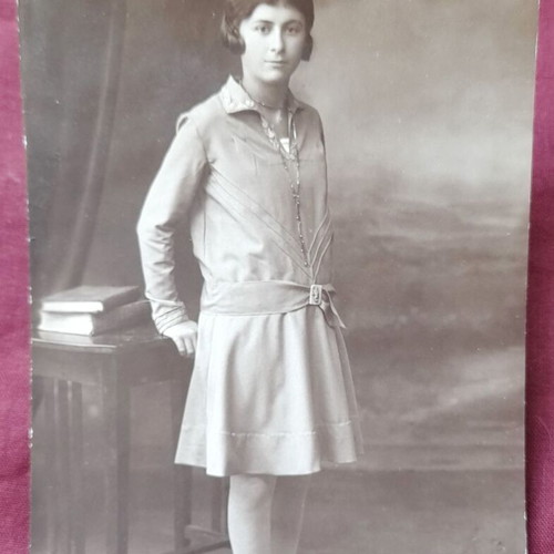 Vintage full-length portrait photograph of a girl from Parnasse studio used