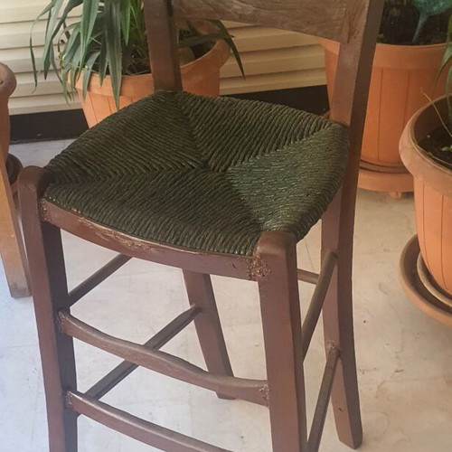 Wooden high chair with woven seat