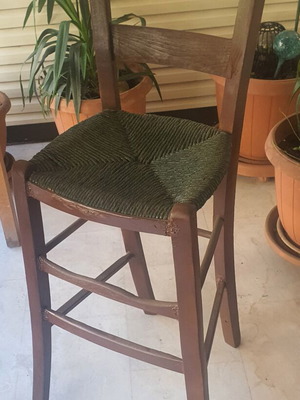 Wooden high chair with woven seat