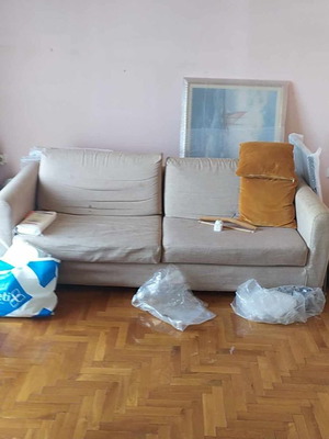 Two-seater sofa with cushions