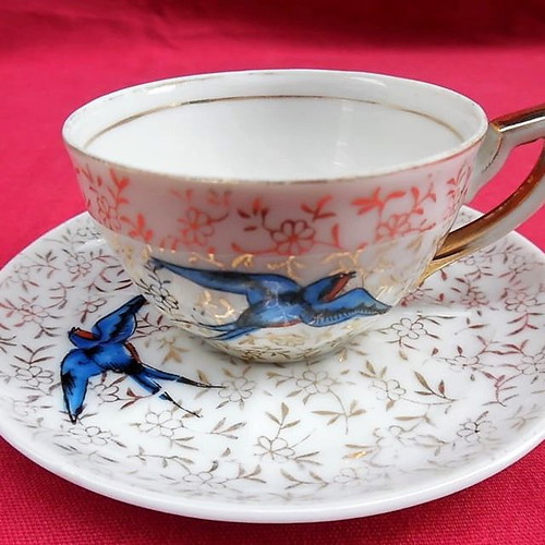 Porcelain cups with blue birds and gold designs, set of 4