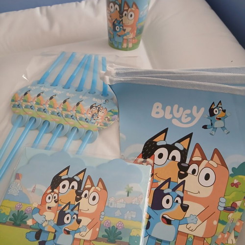 Bluey birthday party set with invitations, straws, cups, knives, and banner