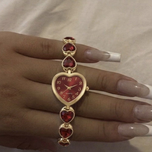 Heart-shaped wristwatch with red stones