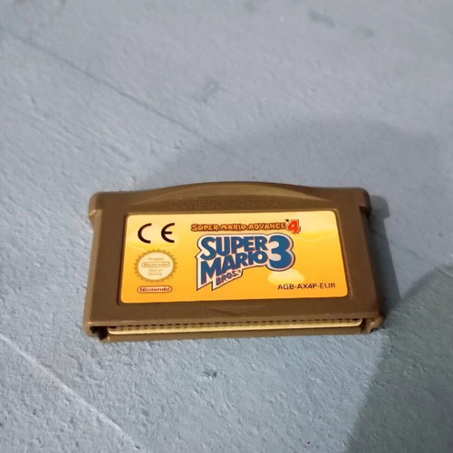 Nintendo Game Boy Advance console with Super Mario 3 cartridge