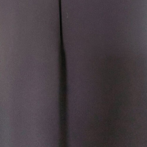 Sleeveless women's blouse black like new with ruffles and sheer detail