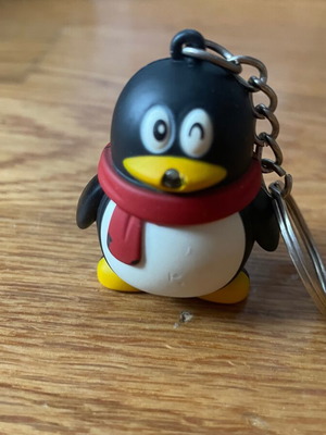 Penguin keychain with light and sound like new