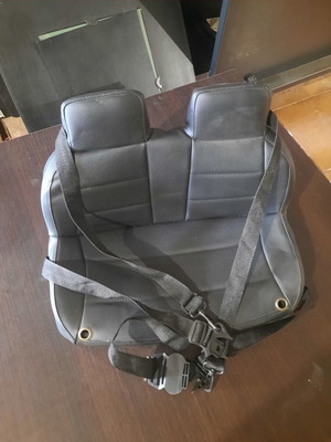 Seat for children's electric ride-on car with safety belts