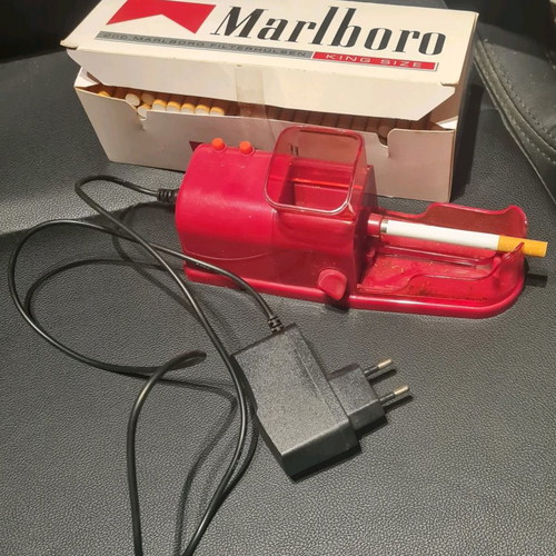 Cigarette filling device with empty cigarettes and filter